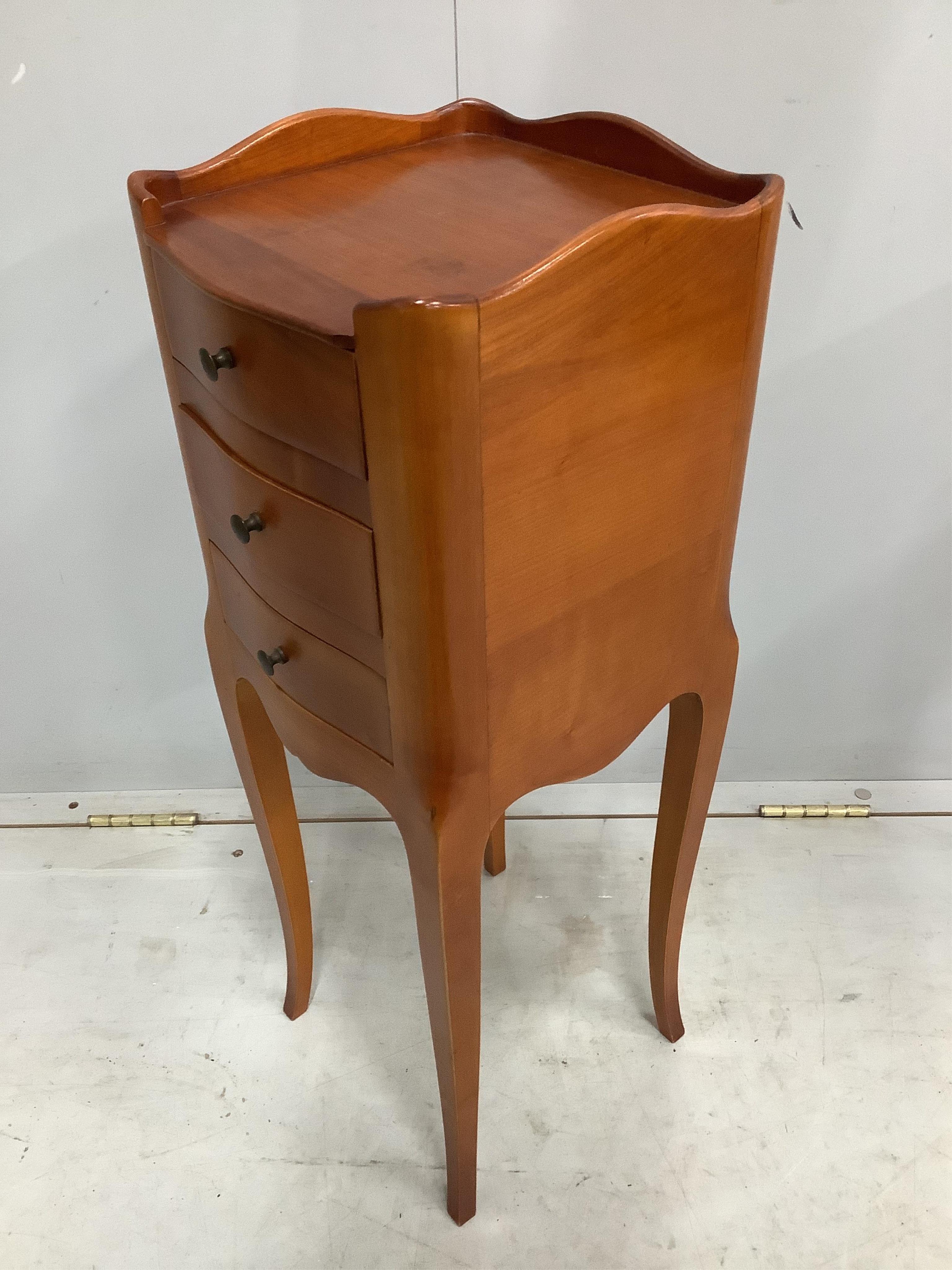 A pair of French cherry three drawer bedside chests, width 24cm, depth 26cm, height 70cm. Condition - fair to good